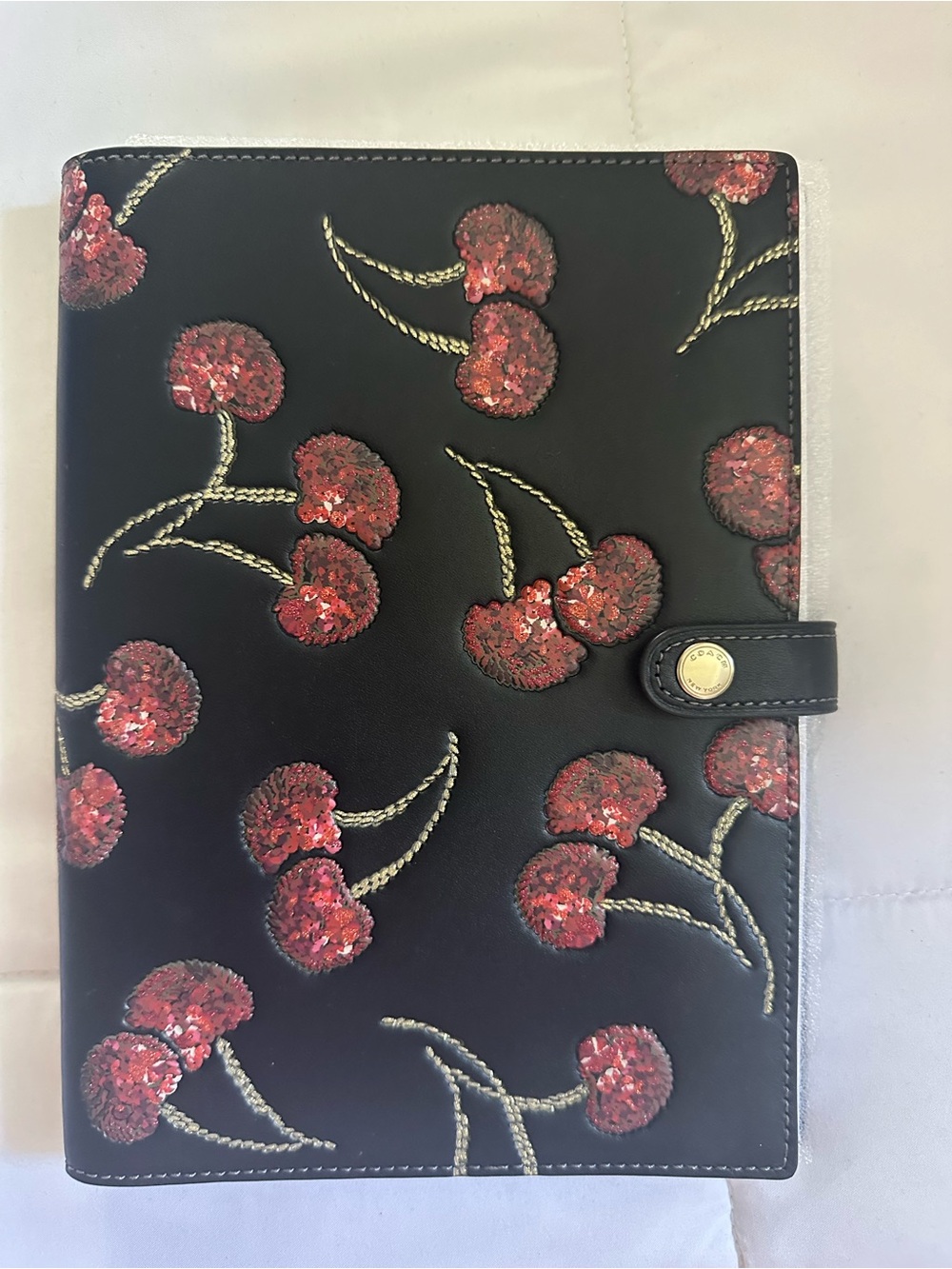 Coach Black Sequin Cherry notebook